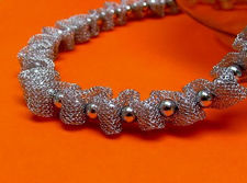 Picture of “Fancy Net” set of necklace and bracelet in sterling silver, mesh interspersed with polished round beads