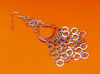 Picture of “Moon” diamond cut basket earrings entirely in polished sterling silver with little chains of flat rings