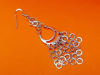 Picture of “Moon” diamond cut basket earrings entirely in polished sterling silver with little chains of flat rings