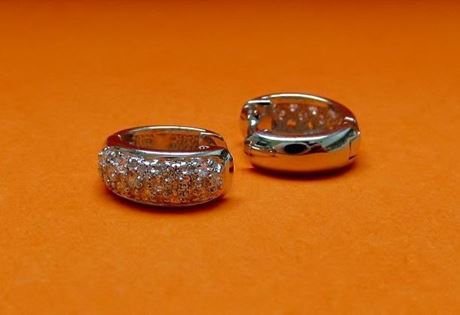 Picture of “Pavé” huggies, hinged earrings in sterling silver inlaid with round cubic zirconia on the front side