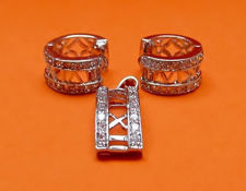 Picture of “Roman numerals” set of pendant and hinged huggies in sterling silver with a row of Roman numerals framed by round cubic zirconia