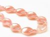 Picture of 19x13 mm, Czech druk beads, twisted leaf, cloud pink, partially transparent, shimmering, 12 pieces