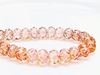Picture of 7x10 mm, carved cruller beads, Czech, transparent, light topaz pink luster