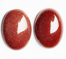 Picture of 10x14 mm, oval, gemstone cabochons, goldstone, red