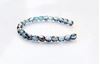 Picture of 3x3 mm, Czech faceted round beads,  light Montana blue, transparent, half tone valentinite luster