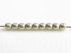 Picture of 3x3 mm, round, Czech druk beads, cloud dream or gold grey, opaque, sueded gold