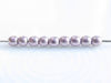 Picture of 2x2 mm, round, Czech druk beads, blackened pearl or silvery purple, opaque, sueded gold